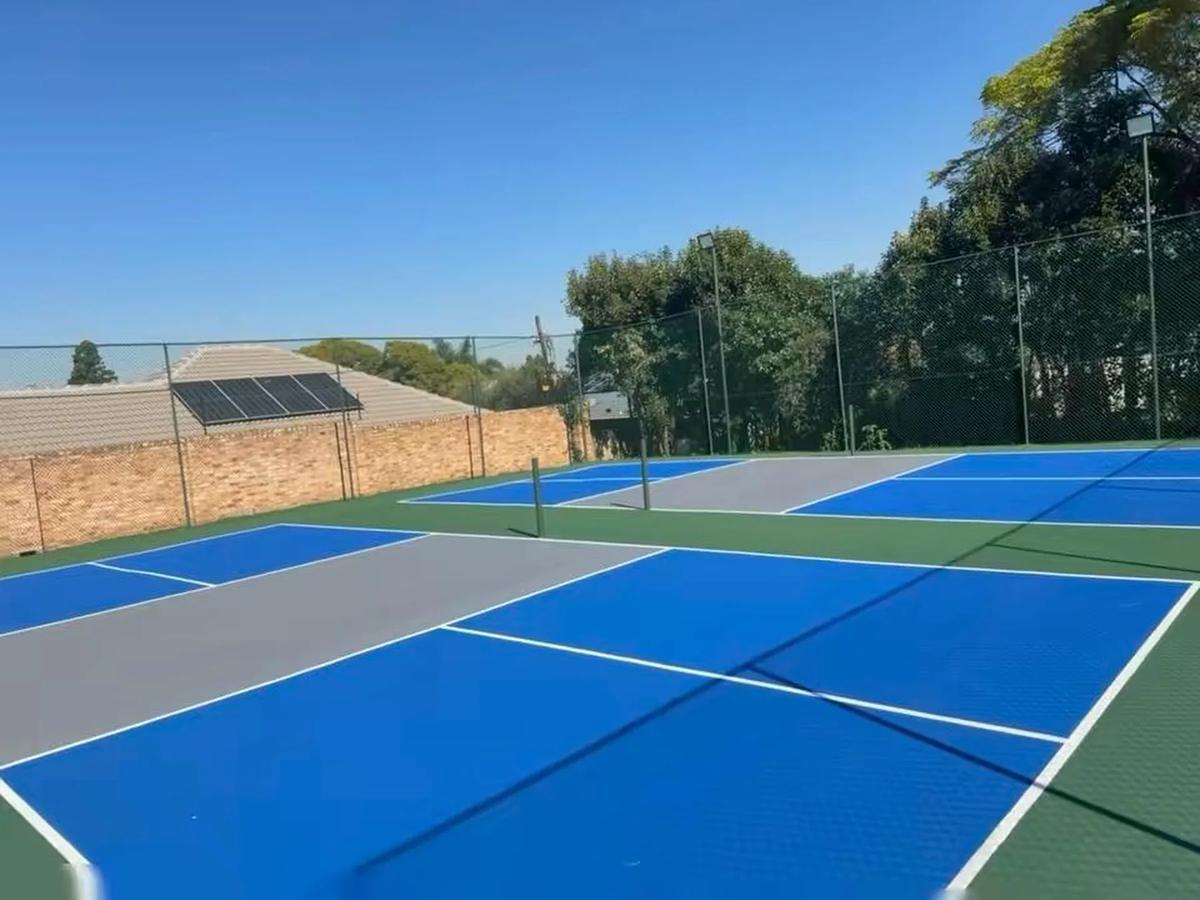 School tennis court in blue and grey